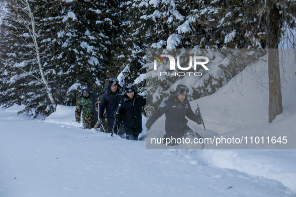 Border police are patrolling the border in heavy snow at -33 degrees Celsius in Altay, Xinjiang Province, China, on February 20, 2024. 