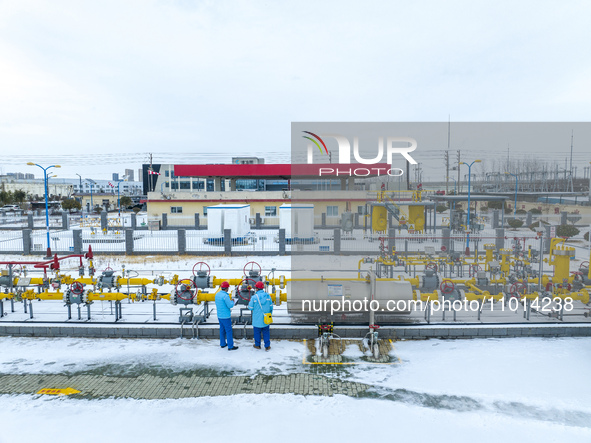 Workers are conducting a safety inspection of gas facilities and equipment at the Gas Gate station in Donghai County, Lianyungang city, East...