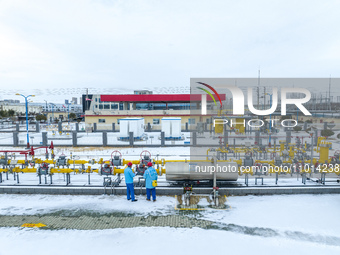 Workers are conducting a safety inspection of gas facilities and equipment at the Gas Gate station in Donghai County, Lianyungang city, East...