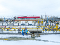 Workers are conducting a safety inspection of gas facilities and equipment at the Gas Gate station in Donghai County, Lianyungang city, East...