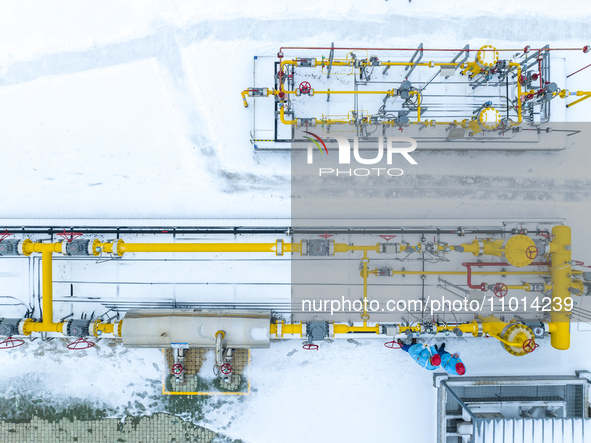 Workers are conducting a safety inspection of gas facilities and equipment at the Gas Gate station in Donghai County, Lianyungang city, East...