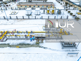 Workers are conducting a safety inspection of gas facilities and equipment at the Gas Gate station in Donghai County, Lianyungang city, East...