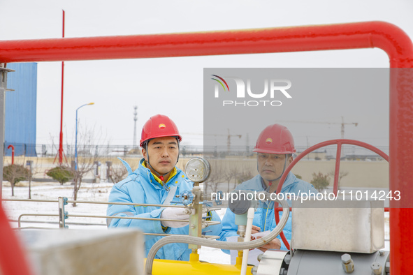 Workers are conducting a safety inspection of gas facilities and equipment at the Gas Gate station in Donghai County, Lianyungang city, East...