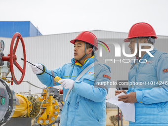 Workers are conducting a safety inspection of gas facilities and equipment at the Gas Gate station in Donghai County, Lianyungang city, East...