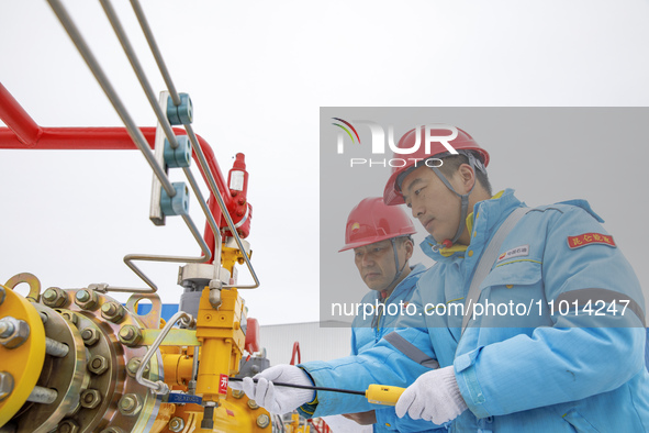 Workers are conducting a safety inspection of gas facilities and equipment at the Gas Gate station in Donghai County, Lianyungang city, East...