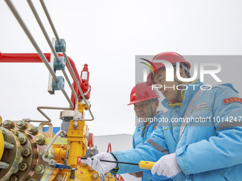 Workers are conducting a safety inspection of gas facilities and equipment at the Gas Gate station in Donghai County, Lianyungang city, East...