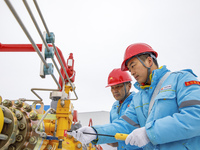 Workers are conducting a safety inspection of gas facilities and equipment at the Gas Gate station in Donghai County, Lianyungang city, East...