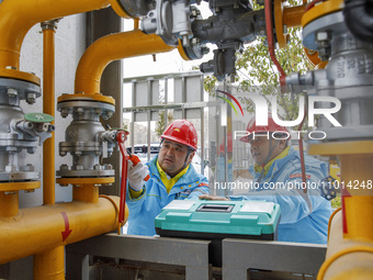 Workers are conducting a safety inspection of gas facilities and equipment at the Gas Gate station in Donghai County, Lianyungang city, East...