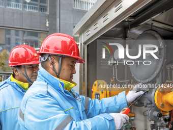 Workers are conducting a safety inspection of gas facilities and equipment at the Gas Gate station in Donghai County, Lianyungang city, East...