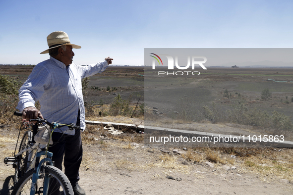 A farmer is pointing out the Zumpango Lagoon, which is affected by the drought due to the lack of rain, in Zumpango de Ocampo, Mexico, on Fe...