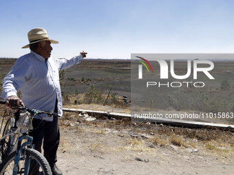 A farmer is pointing out the Zumpango Lagoon, which is affected by the drought due to the lack of rain, in Zumpango de Ocampo, Mexico, on Fe...