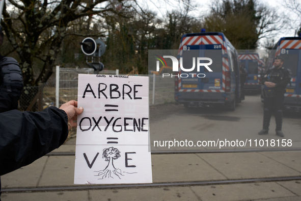 A young woman is holding a placard that reads 'Tree = Oxygen = Life' in Saix, Tarn, France, on February 22, 2024. Michel Forst, the United N...