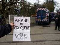 A young woman is holding a placard that reads 'Tree = Oxygen = Life' in Saix, Tarn, France, on February 22, 2024. Michel Forst, the United N...