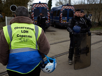 A member of the Observatory of Police Practices (OPP) is being blocked by the Gendarmes Mobiles from entering the ZAD. Michel Forst, the Uni...