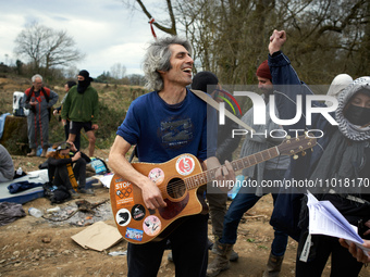 Protesters are singing in support of the 'Ecureuils' who are standing in the trees of the 'Crem'Arbre' ZAD in Saix, Tarn, France, on Februar...