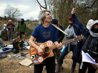 Protesters are singing in support of the 'Ecureuils' who are standing in the trees of the 'Crem'Arbre' ZAD in Saix, Tarn, France, on Februar...