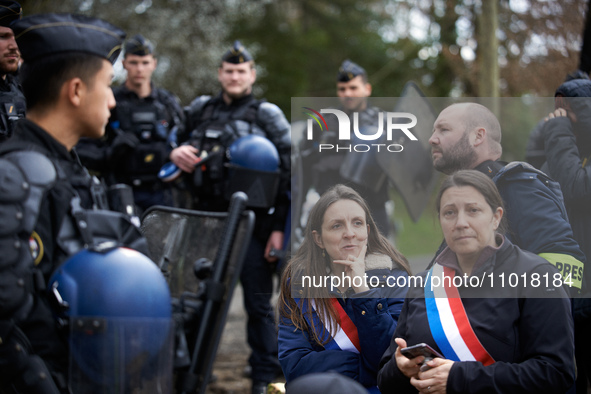 Members of Parliament Anne Stambach-Terrenoir (left) and Karen Erodi are being blocked by the Gendarmerie Mobile. Michel Forst, the United N...