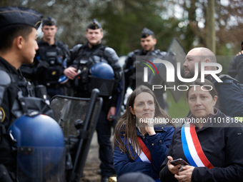 Members of Parliament Anne Stambach-Terrenoir (left) and Karen Erodi are being blocked by the Gendarmerie Mobile. Michel Forst, the United N...