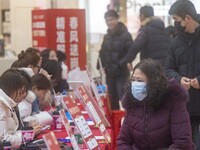 Job seekers are learning about jobs at a job fair in Taizhou, East China's Jiangsu province, on February 25, 2024. (