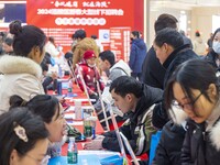 Job seekers are learning about jobs at a job fair in Taizhou, East China's Jiangsu province, on February 25, 2024. (