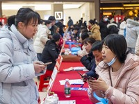 Job seekers are consulting at a large-scale job fair in Taizhou, East China's Jiangsu Province, on February 25, 2024. (