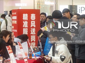 Job seekers are consulting at a large-scale job fair in Taizhou, East China's Jiangsu Province, on February 25, 2024. (