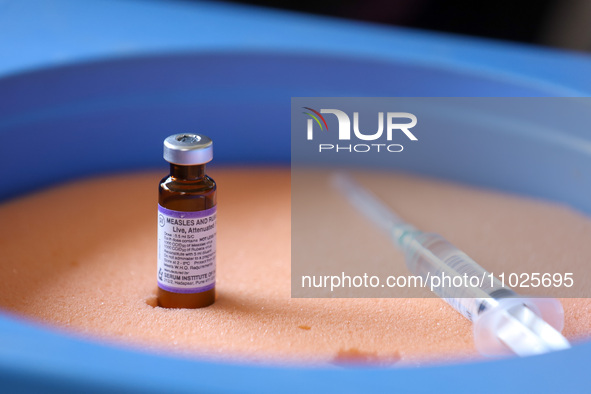 A vial containing the measles-rubella vaccine is sitting on top of an ice pack at an inoculation center in Kathmandu, Nepal, on February 25,...