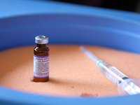 A vial containing the measles-rubella vaccine is sitting on top of an ice pack at an inoculation center in Kathmandu, Nepal, on February 25,...