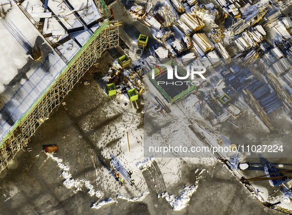 Workers are working at the construction site of Mixheng City in Huai'an, China, on February 25, 2024. 