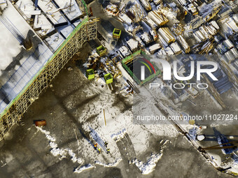 Workers are working at the construction site of Mixheng City in Huai'an, China, on February 25, 2024. (