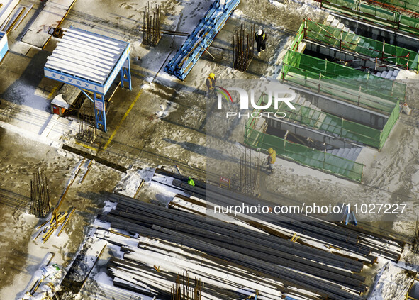 Workers are working at the construction site of Mixheng City in Huai'an, China, on February 25, 2024. 