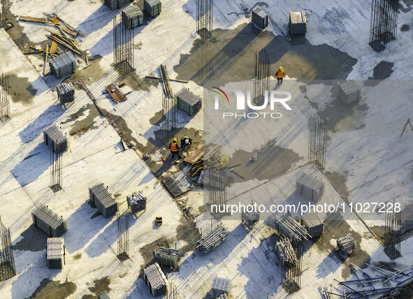 Workers are working at the construction site of Mixheng City in Huai'an, China, on February 25, 2024. 