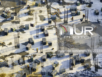 Workers are working at the construction site of Mixheng City in Huai'an, China, on February 25, 2024. (