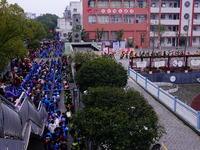 Primary school students are lining up to enter the campus at the start of the new semester in Yichang, Hubei Province, China, on February 26...