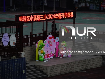 Primary school students are lining up to enter the campus at the start of the new semester in Yichang, Hubei Province, China, on February 26...