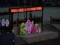 Primary school students are lining up to enter the campus at the start of the new semester in Yichang, Hubei Province, China, on February 26...