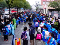 Primary school students are lining up to enter the campus at the start of the new semester in Yichang, Hubei Province, China, on February 26...