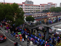 Primary school students are lining up to enter the campus at the start of the new semester in Yichang, Hubei Province, China, on February 26...