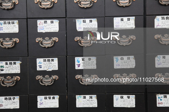 Traditional Chinese medicine cabinets, labeled with the names of various herbs, and hanging medicine scales are being seen in Shantou, Guang...