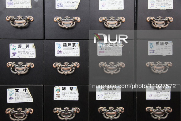 Traditional Chinese medicine cabinets, labeled with the names of various herbs, and hanging medicine scales are being seen in Shantou, Guang...