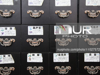 Traditional Chinese medicine cabinets, labeled with the names of various herbs, and hanging medicine scales are being seen in Shantou, Guang...