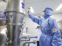 A college student is participating in a pharmaceutical production competition in Huai'an, China, on February 27, 2024. (