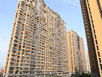 The facade of a high-rise building is blackened after a fire in the Mingshang Xiyuan residential area in the Yuhuatai district, in Nanjing,...