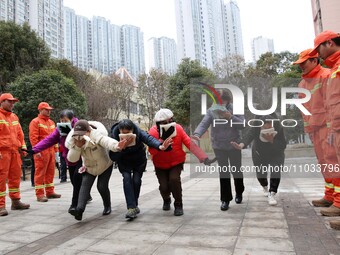 Firefighters are guiding residents to escape a fire in Lianyungang, China, on February 28, 2024. (