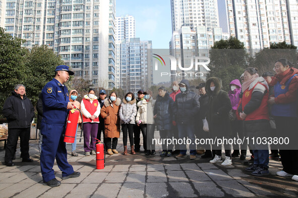 Firefighters are explaining the use of fire-fighting equipment to residents in Lianyungang, China, on February 28, 2024. 