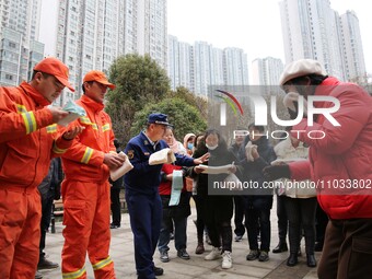 Firefighters are guiding residents to escape a fire in Lianyungang, China, on February 28, 2024. (