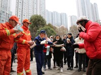 Firefighters are guiding residents to escape a fire in Lianyungang, China, on February 28, 2024. (