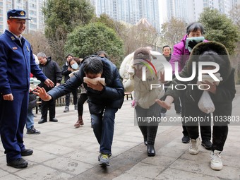 Firefighters are guiding residents to escape a fire in Lianyungang, China, on February 28, 2024. (