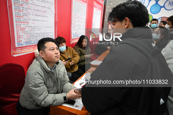 A large number of job seekers are attending a spring job fair in Shenyang, Liaoning Province, China, on February 28, 2024. 