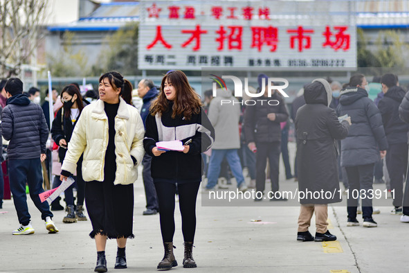 Job seekers are learning about jobs at a job fair held by the Qingzhou Federation of Trade Unions in Shandong Province, East China, on Febru...